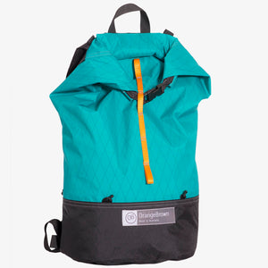 Ultralight day pack with roll closure in teal-black. Handmade in Australia from X-Pac fabrics.