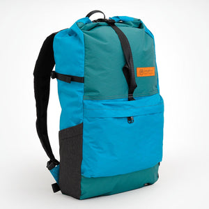 Side view of OrangeBrown OB20 Daypack with stretch mesh pocket and compression strap.