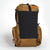 Ultralight hiking backpack OB30 coyote/brown colour. The main compartment is packed and three external pockets empty. Front pocket is made from dark grey stretch mesh.
