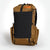 Ultralight hiking backpack OB30 coyote/brown colour. The main compartment is packed and three external pockets empty.
