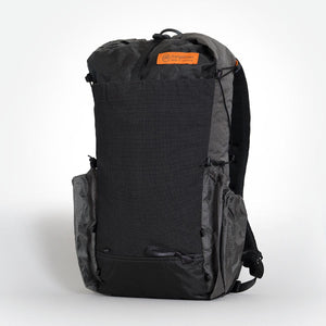 OrangeBrown backpack OB30 the main compartment packed. One pocket per side and a front stretch pocket. Made from Ultra 200X fabric in black and grey.