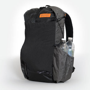Ultralight hiking backpack OB30 in black and white. Two water bottles in side pocket. Made by OrangeBrown in Australia.
