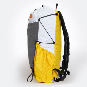 Sideview of a yellow/white backpack with side pocket and compression cords using a LineLoc3. Made by OrangeBrown Australia.