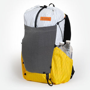 Ultralight hiking backpack OB30 yellow/white. With two water bottles in side pocket. Made by OrangeBrown in Australia.