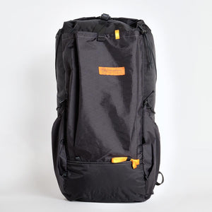 OrangeBrown backpack OB 36 made in Australia. Handmade from black X-Pac fabric. Featuring large front pocket and two side pockets.