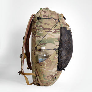Sideview of OrangeBrown backpack OB36. Side panels with compression cords using a LineLoc 3 for adjustments.