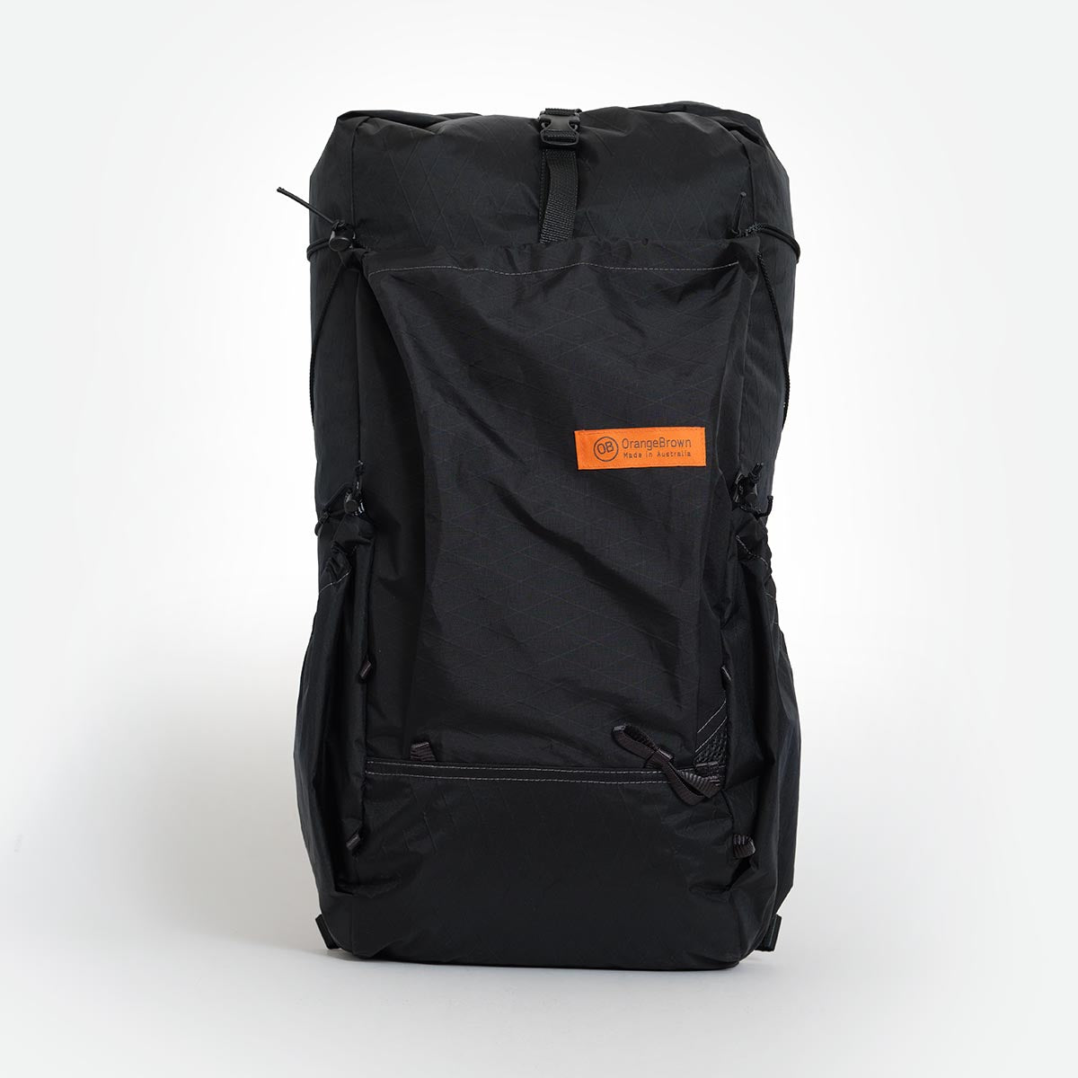 Black hiking backpack made by Orangebrown. Featuring a front and two side pockets. Made from X-Pac VX21 fabric