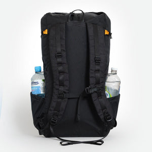 Australian made backpack OB 36 in black with padded shoulder straps. A water bottle in each side pocket.