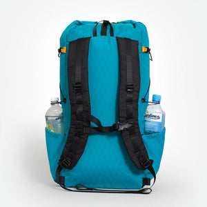 Australian made day pack OB 36 in teal with padded shoulder straps. A water bottle in each side pocket.