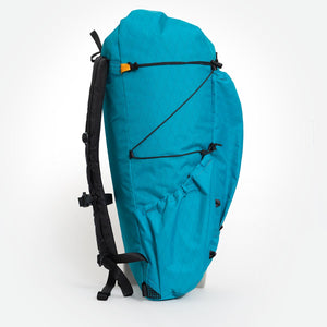 Side view of backpack OB 36 with side pocket and compression cords visible. Handmade in Australia.