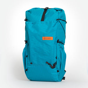Ultralight hiking backpack made by OrangeBrown. Featuring a front and two side pockets. Handmade from teal coloured X-Pac VX21 fabric in Australia