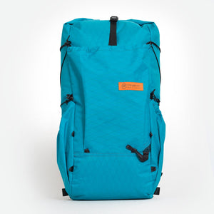 Teal hiking backpack made by Orangebrown. Featuring a front and two side pockets. Handmade from X-Pac VX21 fabric in Australia