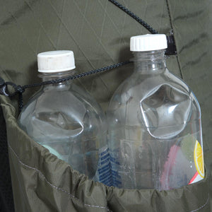 The pocket on the right of the OB 48 fits two 1.25L bottles. Compression cords can hold longer items in place.