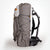 Sideview of OrangeBrown OB55 backpack. Compression cord and large side pocket.