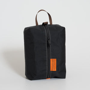 OrangeBrown packing cube made from black VX21 X-Pac fabric . YKK zipper #3 with two sliders for easy opening and a webbing loop for hanging.