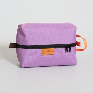 Australian made packing cube. A packing cell for travel and hiking made from mulberry X-Pac fabric VX21. YKK zipper #3 with two sliders for easy opening and a webbing loop for hanging.