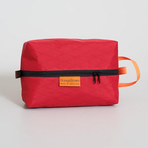 Red packing cube made from VX21 X-Pac fabric . YKK zipper #3 with two sliders for easy opening and a webbing loop for hanging. Made in Australia