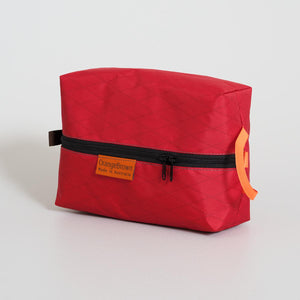 Red packing cube made from VX21 X-Pac fabric . YKK zipper #3 with two sliders for easy opening and a webbing loop for hanging. Made in Australia