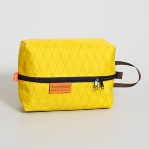 Yellow packing cube, packing cell for travel and hiking. Made in Australia from X-Pac  VX21 fabric.