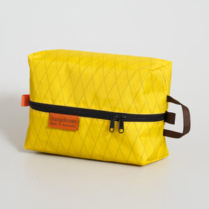 Yellow packing cube, packing cell for travel and hiking. Made in Australia from X-Pac  VX21 fabric.