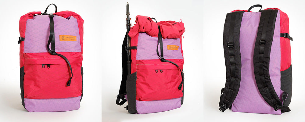 Pink and purple backpack with black straps on a white background. Made in Australia.