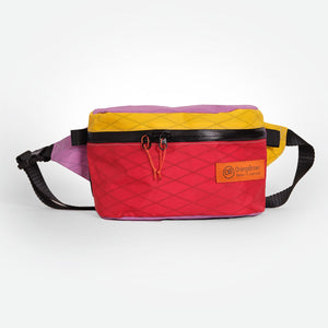 Multicolored fanny pack made from X-Pac VX21 fabric. With a secret pocket on the back and a YKK #5 zipper for the main compartment.