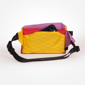 Multicolored fanny pack made from X-Pac VX21 fabric. With a secret pocket on the back and a YKK #5 zipper for the main compartment.