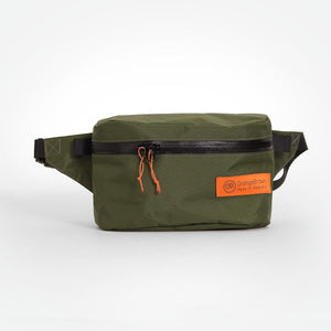 Dark green bum bag made from X-Pac VX21 fabric. With a secret pocket on the back and a YKK #5 zipper for the main compartment.