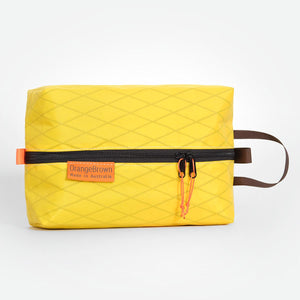Yellow packing cube, packing cell for travel and hiking. Made in Australia from X-Pac  VX21 fabric.
