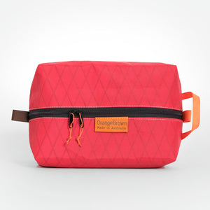 Red packing cube made from VX21 X-Pac fabric . YKK zipper #3 with two sliders for easy opening and a webbing loop for hanging. Made in Australia