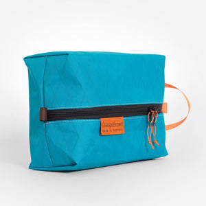 Packing acking cell made from teal coloured X-Pac VX21 X-Pac fabric . YKK zipper #3 with two sliders for easy opening and a webbing loop for hanging. Made in Australia