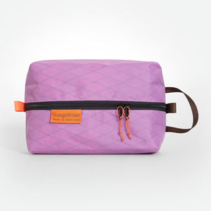 Australian made packing cube. A packing cell for travel and hiking made from mulberry X-Pac fabric VX21. YKK zipper #3 with two sliders for easy opening and a webbing loop for hanging.