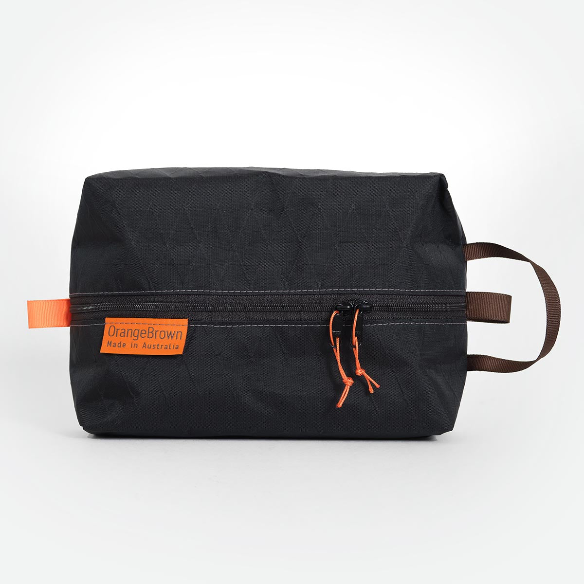 OrangeBrown packing cube made from black VX21 X-Pac fabric . YKK zipper #3 with two sliders for easy opening and a webbing loop for hanging. 