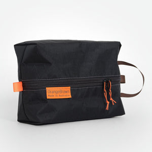 OrangeBrown packing cube made from black VX21 X-Pac fabric . YKK zipper #3 with two sliders for easy opening and a webbing loop for hanging.