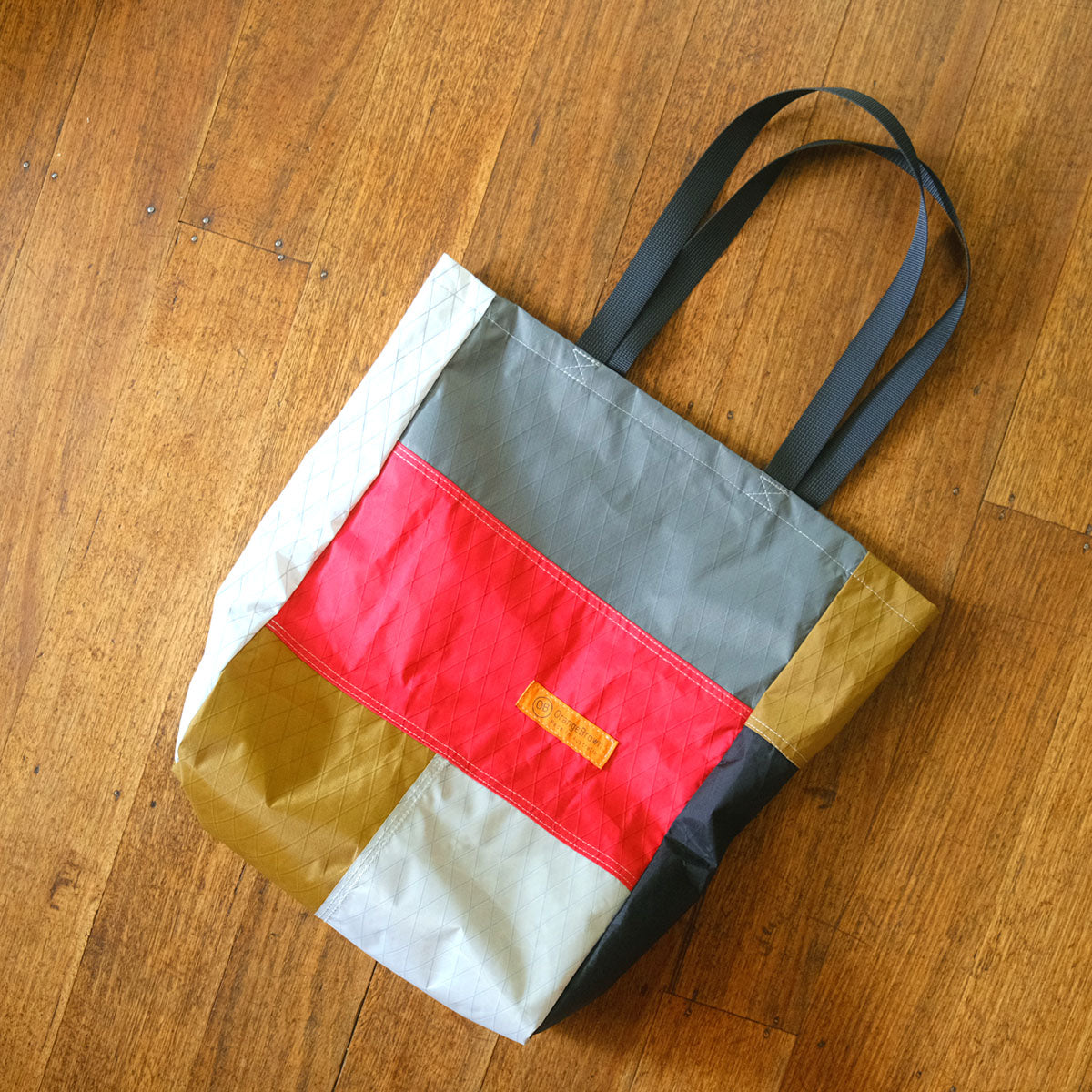 A-side. ‘The Bag’ by OrangeBrown. Tote, shopping or shoulder bag made from hi-tech fabrics. Each bag is unique. Made in Australia.