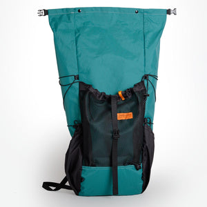 OrangeBrown backpack with a 36L volume in green X-Pac fabric.  The roll top wide open showing the full height of the pack.  Made in Australia