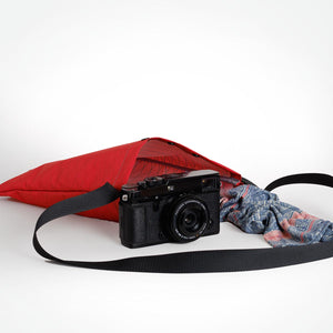 The OrangeBrown sling bag made from X-Pac VX21 fabric used for carrying a FujiFilm X camera