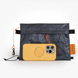Sternum strap bag made from X-Pac Liteskin 07 fabric. With iphone 15 pro for size comparison.