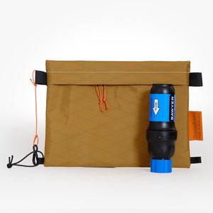 Coyote colour sternum strap bag made from X-Pac VX21 fabric. Sawyer Squeeze filter for size comparison.
