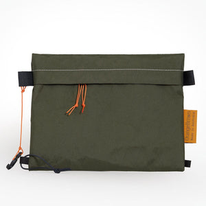 Sternum strap bag made from dark green X-Pac VX21 fabric. A mobile phone and snacks easily fit into the bag. 