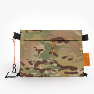 Camouflage sternum strap bag made from black X-Pac X-33 fabric with Cordura® face fabric.