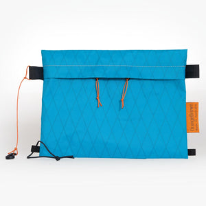 Sternum strap bag made from teal X-Pac VX21 fabric. Slides over the sternum strap of a backpack.