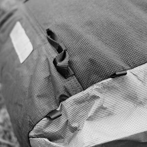 Ice axe loop pulled aside. OrangeBrown backpack OB30