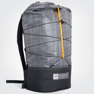 Side view of ultralight day pack hand made from X-Pac fabric with roll closure in colour grey-black. Made in Australia.