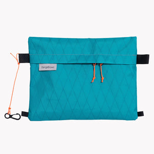 Sternum strap bag made from teal X-Pac VX21 fabric. Slides over the sternum strap of a backpack.